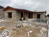 BUCA KAYNAKLARDA 2 DÖNÜM ARAZİ ÜZERİNDE 500 m2 TAŞ EV